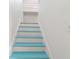 Stairway with white walls and treads painted white and blue at 723 S Brevard Ave, Tampa, FL 33606