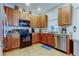Well-equipped kitchen with stainless steel appliances, granite countertops, and ample cabinet space at 7513 S Sparkman St, Tampa, FL 33616
