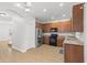 Kitchen boasts stainless steel appliances, granite countertops, and abundant cabinet space at 7513 S Sparkman St, Tampa, FL 33616