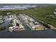 Aerial view of the canal neighborhood showing the waterfront homes and boat access at 832 Seabreeze Dr, Ruskin, FL 33570