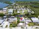 Aerial view of the canal neighborhood with various waterfront homes and boats at 832 Seabreeze Dr, Ruskin, FL 33570