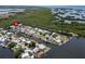 Gorgeous aerial view of waterfront homes featuring access to canals and views of a lush mangrove ecosystem at 832 Seabreeze Dr, Ruskin, FL 33570