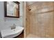 Tiled bathroom featuring walk-in shower, modern vanity, and sleek fixtures at 832 Seabreeze Dr, Ruskin, FL 33570