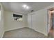 Empty bedroom featuring neutral walls, tile floors, closet, and one window at 832 Seabreeze Dr, Ruskin, FL 33570