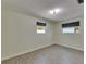 Empty bedroom with tile floors, neutral paint, and two windows at 832 Seabreeze Dr, Ruskin, FL 33570