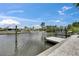 The waterfront home features a private dock on the canal, perfect for boating and fishing at 832 Seabreeze Dr, Ruskin, FL 33570