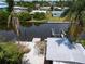 A high-angle canal view shows the boat lift and waterfront access of the property at 832 Seabreeze Dr, Ruskin, FL 33570