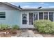 The home's exterior shows a charming front door and an inviting entry area at 832 Seabreeze Dr, Ruskin, FL 33570