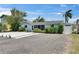 Charming single-story home with a gravel yard and colorful landscaping at 832 Seabreeze Dr, Ruskin, FL 33570
