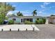 Inviting single-story home with well-maintained gravel yard and lush, mature landscaping at 832 Seabreeze Dr, Ruskin, FL 33570