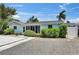 Charming one-story home with screened entry and mature plantings at 832 Seabreeze Dr, Ruskin, FL 33570