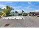 Cozy one-story home with a gravel yard and mature tree, plus tidy side yard at 832 Seabreeze Dr, Ruskin, FL 33570