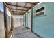 Side entrance to home with walkway and wooden deck at 832 Seabreeze Dr, Ruskin, FL 33570