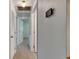 Hallway showing neutral walls, wood-look tile flooring and closet doors for ample storage at 832 Seabreeze Dr, Ruskin, FL 33570
