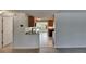 Open kitchen with tile floors, wood cabinets, and a breakfast bar at 832 Seabreeze Dr, Ruskin, FL 33570