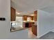 Open kitchen layout, perfect for entertaining with tile floor and wood cabinetry at 832 Seabreeze Dr, Ruskin, FL 33570