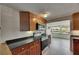 Modern kitchen with stainless steel appliances, granite countertops, and tile flooring at 832 Seabreeze Dr, Ruskin, FL 33570