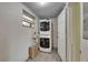 Stacked washer and dryer in laundry area with tiled floor at 832 Seabreeze Dr, Ruskin, FL 33570