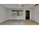 Bright living room featuring a ceiling fan, neutral paint, and wood-look tile flooring throughout at 832 Seabreeze Dr, Ruskin, FL 33570