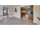 Spacious living room with wood-look tile floors and access to other rooms at 832 Seabreeze Dr, Ruskin, FL 33570