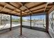 Enclosed patio with wooden floors and views of the waterfront at 832 Seabreeze Dr, Ruskin, FL 33570
