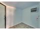 Light blue room with tile flooring and an air conditioning unit at 832 Seabreeze Dr, Ruskin, FL 33570