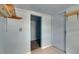 Light blue room with shelving and doorway, offering versatile space at 832 Seabreeze Dr, Ruskin, FL 33570