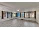 Large sunroom featuring wood-look tile flooring and natural light from multiple windows at 832 Seabreeze Dr, Ruskin, FL 33570