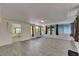 Expansive sunroom featuring wood-look tile flooring and access to multiple doors at 832 Seabreeze Dr, Ruskin, FL 33570