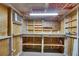 Workshop with AC unit, shelving, pegboard, and work surfaces at 832 Seabreeze Dr, Ruskin, FL 33570