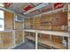 Well-lit workshop featuring ample shelving and work surfaces at 832 Seabreeze Dr, Ruskin, FL 33570