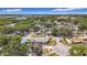 A serene neighborhood featuring cozy homes and mature trees, nestled near a tranquil lake, providing a peaceful residential setting at 8345 81St Ct, Seminole, FL 33777