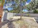 Spacious back yard features a quaint patio area, mature trees, and a privacy fence at 8345 81St Ct, Seminole, FL 33777