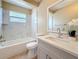 Updated bathroom featuring marble tiling around the tub and shower and a new sink with vanity at 8345 81St Ct, Seminole, FL 33777