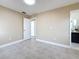 Bedroom featuring tile flooring, neutral paint, an attached bathroom and a large closet at 8345 81St Ct, Seminole, FL 33777