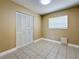 This bedroom offers neutral colored walls, a window, and double door closet to maximize storage space at 8345 81St Ct, Seminole, FL 33777