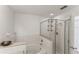 Bathroom featuring a tiled shower, bathtub, and ample counter space at 8518 Broken Willow Ct, Tampa, FL 33647