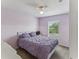 Cozy bedroom featuring plush bedding, natural light, and neutral decor at 8518 Broken Willow Ct, Tampa, FL 33647