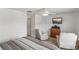 Bedroom featuring comfortable seating and a dresser with a mounted TV at 8518 Broken Willow Ct, Tampa, FL 33647