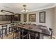 Open concept dining area and kitchen featuring modern decor and seating for the whole Gathering at 8518 Broken Willow Ct, Tampa, FL 33647