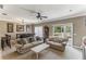 Inviting living room with stylish furnishings, fan, and natural light at 8518 Broken Willow Ct, Tampa, FL 33647