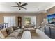 Comfortable living room with neutral tones, fan, and sliding door at 8518 Broken Willow Ct, Tampa, FL 33647