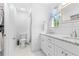 Fresh bathroom featuring double sinks, tile surround, and modern fixtures at 8717 Betty St, Port Richey, FL 34668