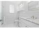 Bright bathroom featuring a stylish vanity, sleek fixtures, and modern design at 8717 Betty St, Port Richey, FL 34668