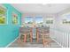 Intimate indoor sitting area with barstool chairs and ample natural light from surrounding windows at 8717 Betty St, Port Richey, FL 34668