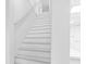 Bright white staircase with natural light and clean design at 8717 Betty St, Port Richey, FL 34668