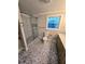 Updated bathroom with a glass shower, stylish tile, and modern vanity at 9830 Sheryl Dr, New Port Richey, FL 34654
