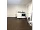 The laundry room features a washer and dryer set, ample space and neutral decor at 9830 Sheryl Dr, New Port Richey, FL 34654