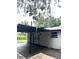 The outdoor patio features sleek designs, with neutral color palette and seamless blending to the interior at 9830 Sheryl Dr, New Port Richey, FL 34654