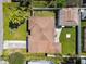 Overhead view of the property with a well-maintained lawn and an adjacent building at 6914 N Ola Ave, Tampa, FL 33604